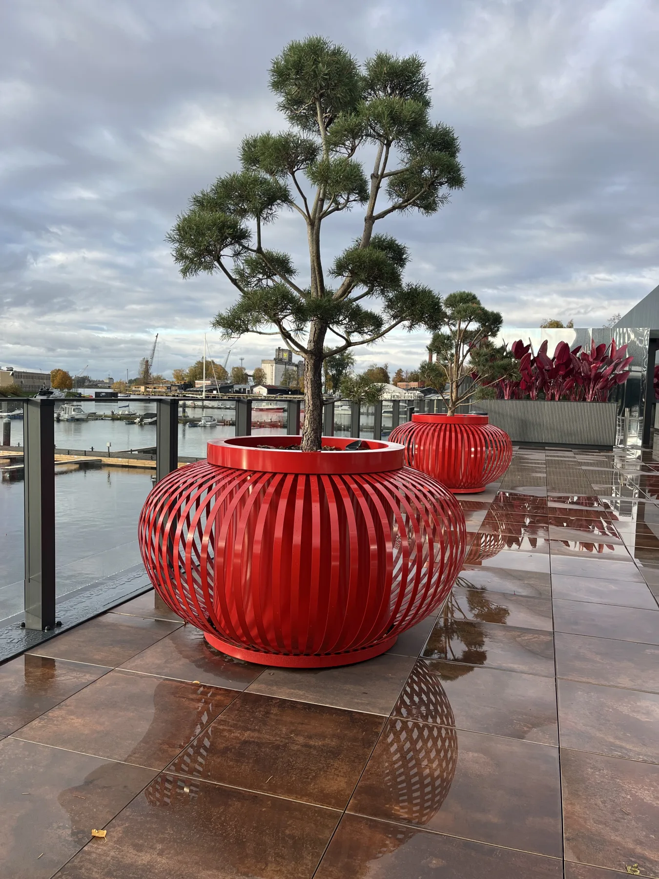 Close view of red ribbed planters on the ExPorto waterfront terrace