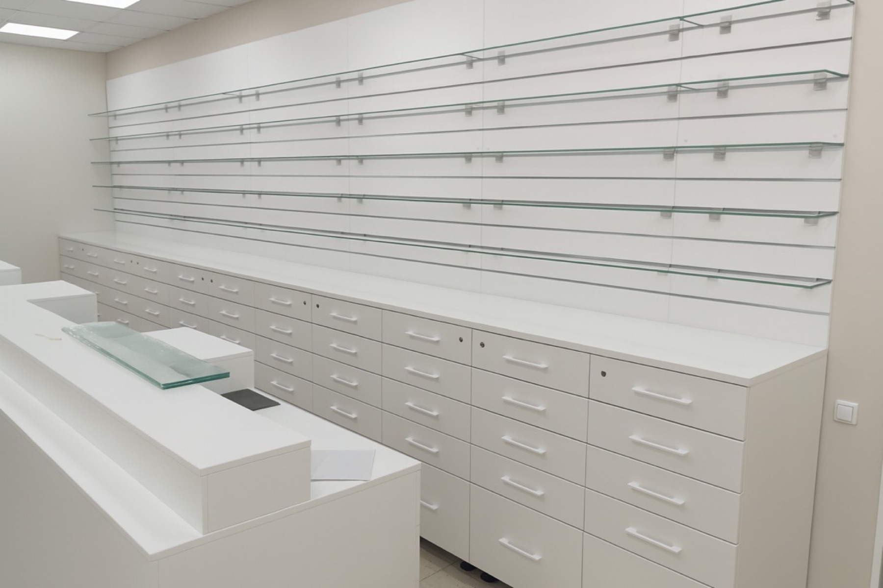 White retail shelving and drawer system